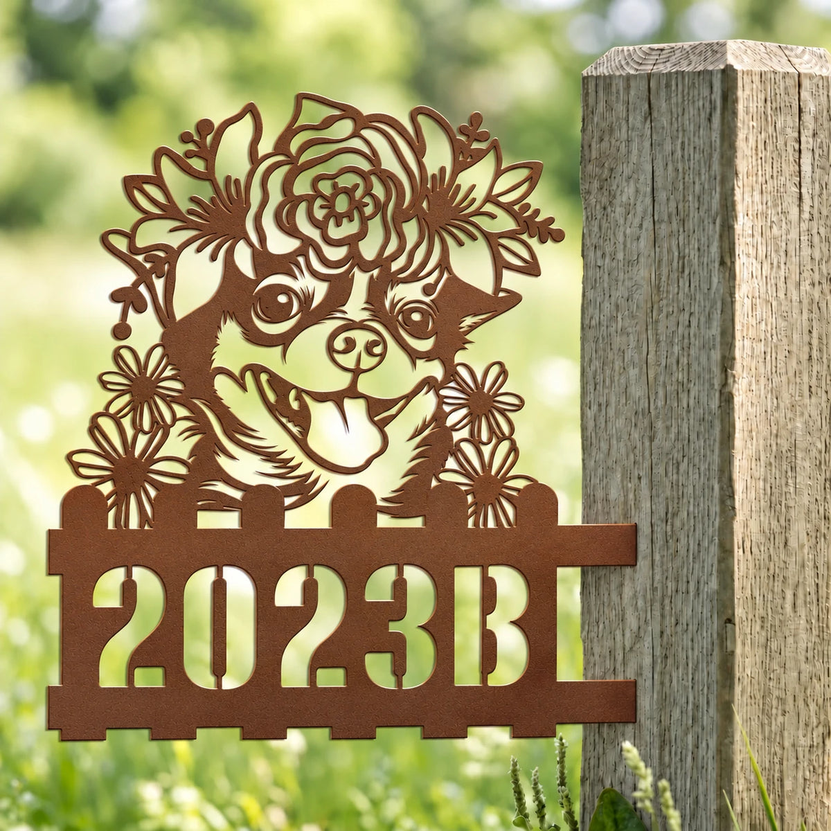 Chihuahua custom metal house number sign with floral crown mounted on a garden post.